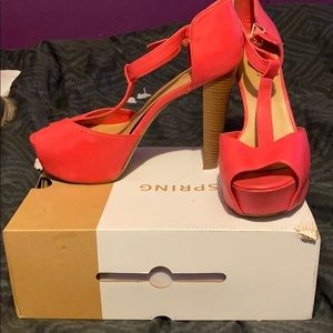 Pink platform peep toe pumps